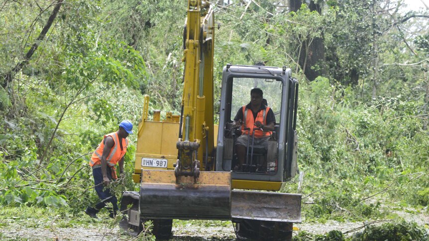 Police and disaster management crews in Fiji begin road clearing operations after Tropical Cyclone Winston.