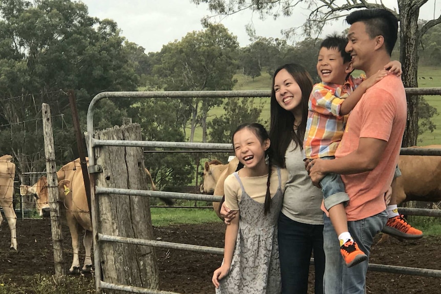 People visiting a dairy farm outside of Brisbane.