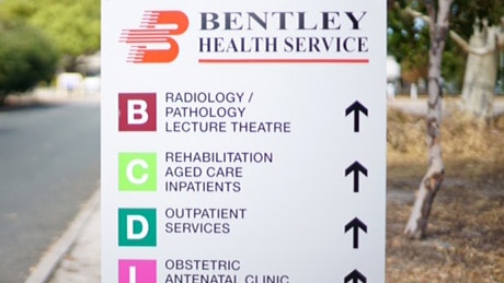 Sign at Bentley Hospital with directions to different departments.