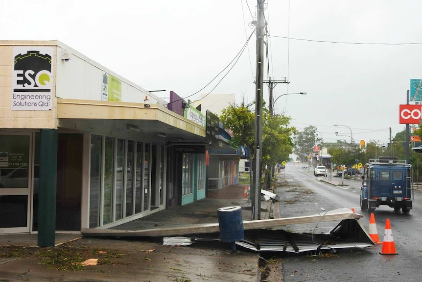 Building debris from the storm on a main street in Hervey Bay.