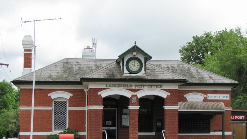 The Lancefield post office in Victoria shows the town clock and the red brick exterior.