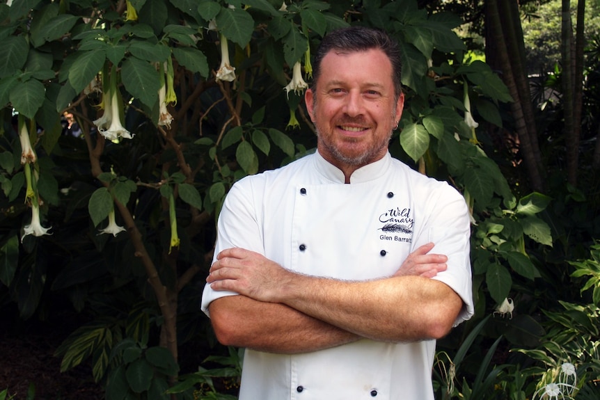 Executive Chef Glen Barratt standing in the gardens of Wild Canary restaurant