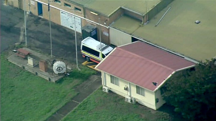 An ambulance sits at the Austar coal mine at Paxton, where two men died in a mine collapse.