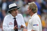 Umpire Billy Bowden explains to Shane Warne his decision to offer England bad light at The Oval.