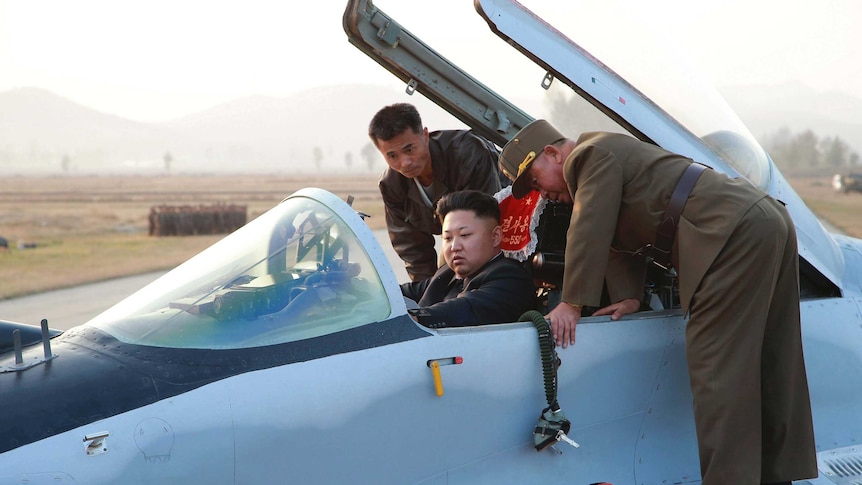 Kim Jong-un sits in a fighter jet