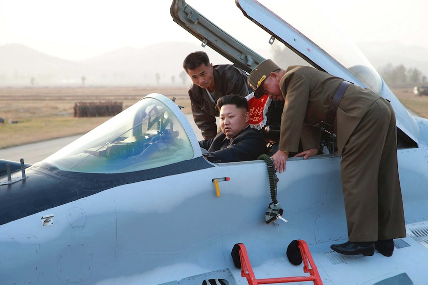 Kim Jong-un sits in a fighter jet