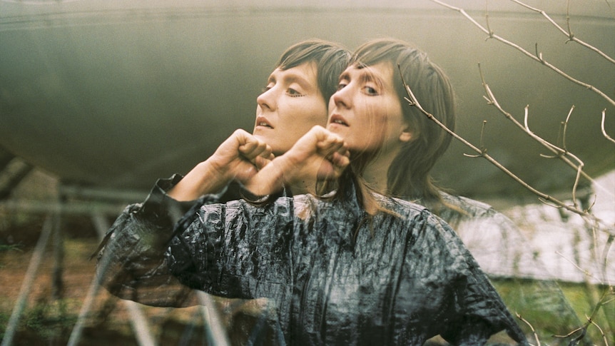 Musician Cate Le Bon rests her chin on her hand