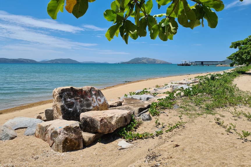 Yellow sand and blue water on Palm Island.