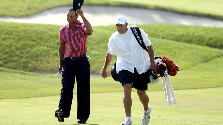 Steve Williams (R), now caddie for Australia's Adam Scott, volleyed a racist remark against Tiger Woods at a Shanghai awards ceremony.