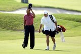 Steve Williams (R), now caddie for Australia's Adam Scott, volleyed a racist remark against Tiger Woods at a Shanghai awards ceremony.