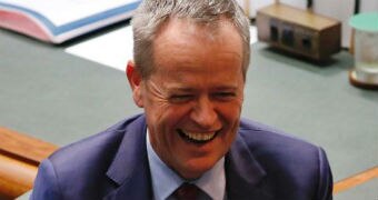 Bill Shorten laughs in Parliament.