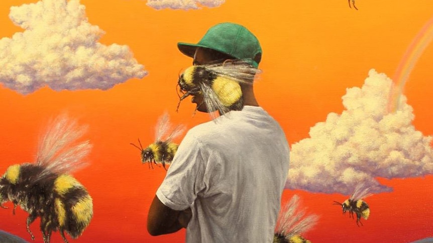 Tyler The Creator with bees on orange background