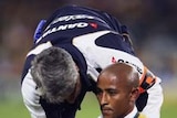 George Gregan is treated by the team doctor as Australia beats South Africa in Sydney
