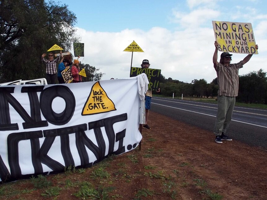 Locals protest fracking at a roadside protest in south west WA.
