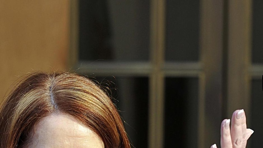 Julia Gillard at a press conference with Greg Combet