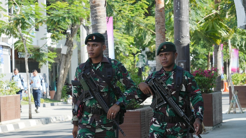 Indonesian soldiers patrol on a street in Labuan Bajo, East Nusa Tenggara province, Indonesia.