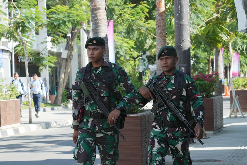 Indonesian soldiers patrol on a street in Labuan Bajo, East Nusa Tenggara province, Indonesia.