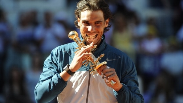 Rafael Nadal poses with his trophy after winning the men's singles final tennis match of the Madrid Masters