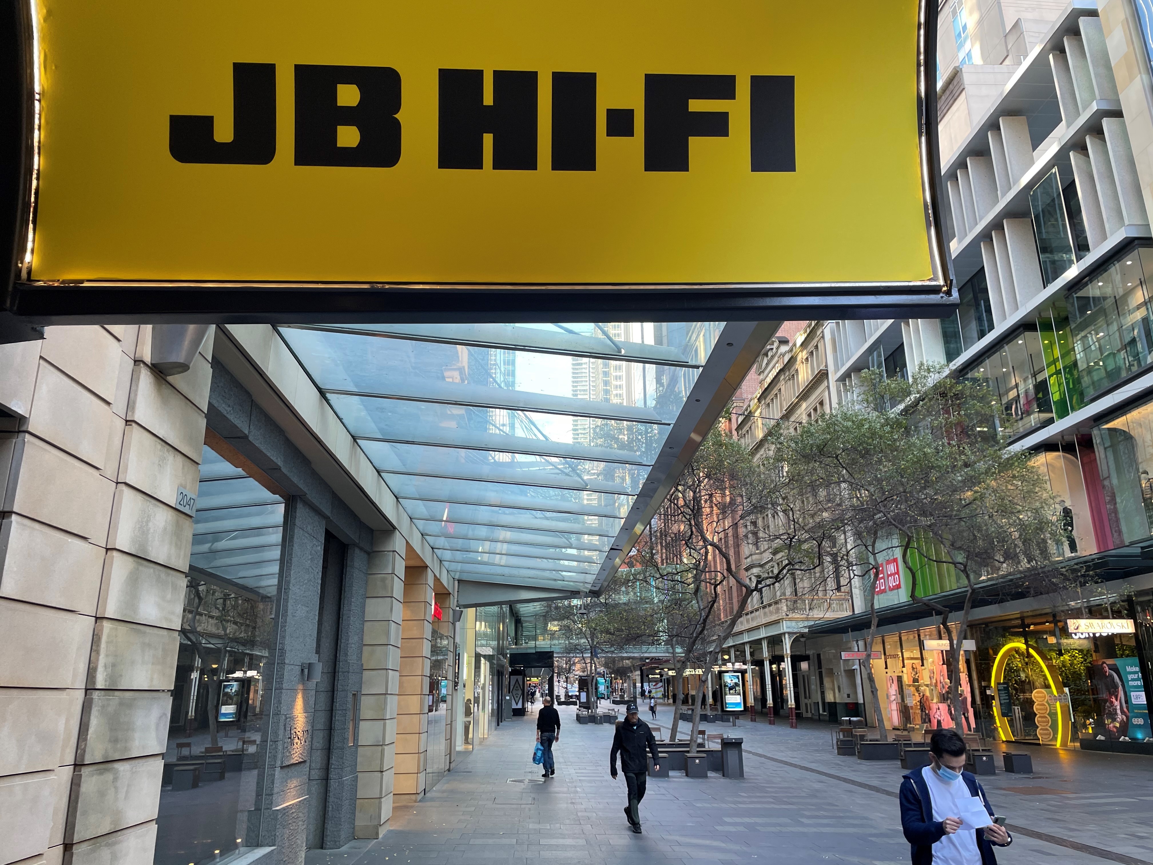 ASX down as reporting season rolls on, JB HiFi and Bluescope lift