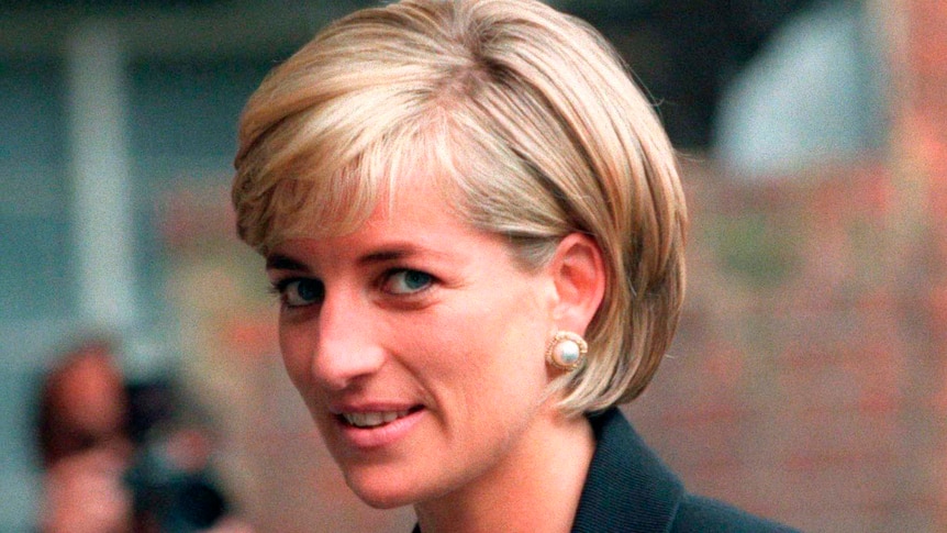 Princess Diana wearing pearl earrings with a slight smile on her face