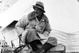 A black-and-white image of George Finch wearing the world's first puffer jacket at Everest base camp