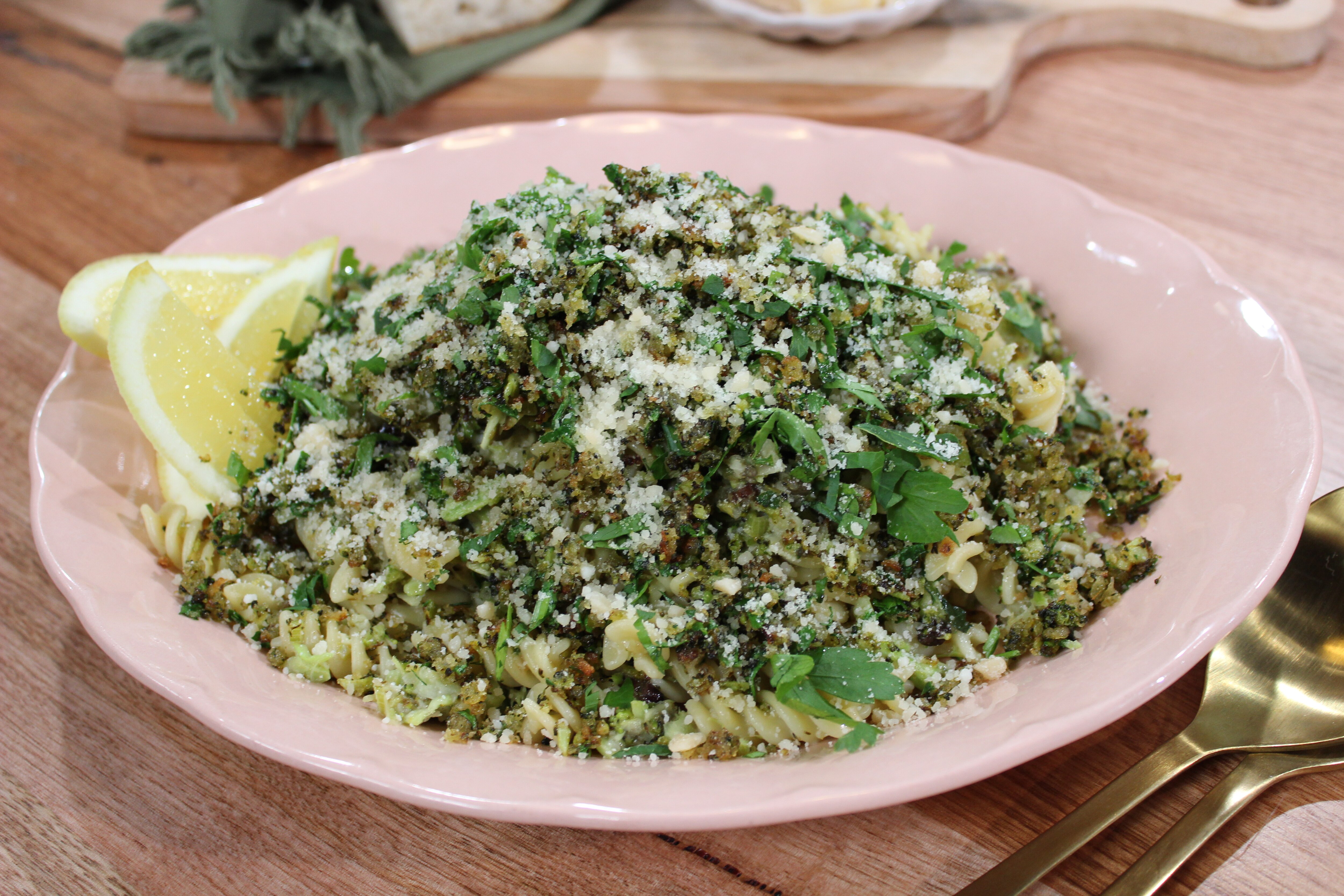 box grater broccoli pasta finished dish in serving bowl on bench top