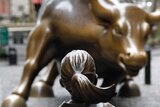 The Fearless Girl faces the Wall Street bull.