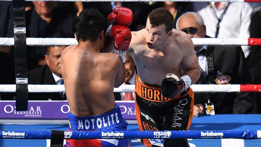 Jeff Horn (right) lands a punch on Manny Pacquiao early in the bout.
