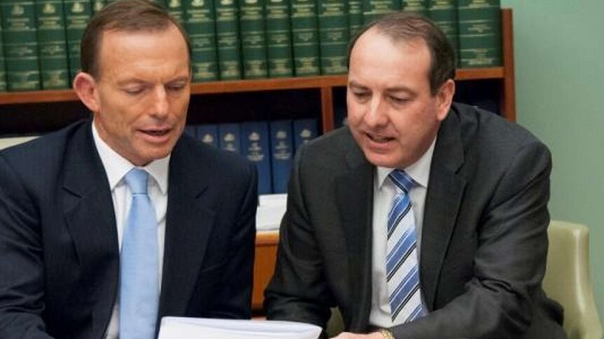 Dr Peter Hendy MP poses with Prime Minister Tony Abbott in Parliament.