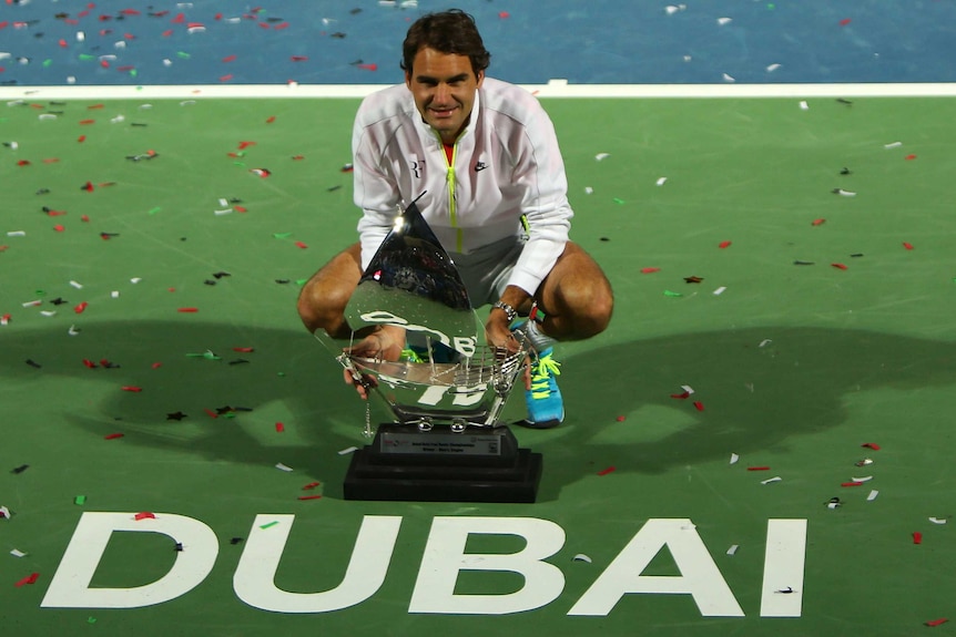 Roger Federer celebrates his seventh Dubai Open title