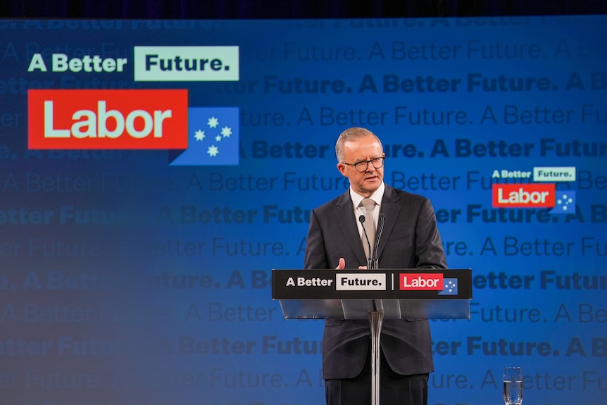 Anthony Albanese speaking at a lecturn with Labor branding