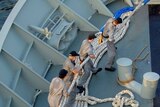 Ship hands heave in HMAS Success lines