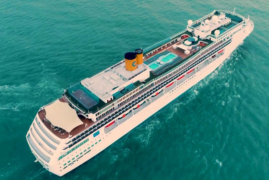 An aerial view of the Costa Victoria cruise ship sailing in a green ocean.