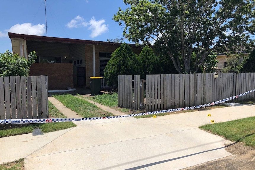 Police tape around house in Bundaberg here a 36-year-old woman was found dead.