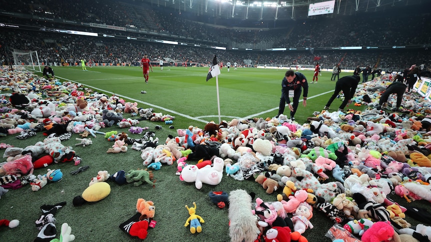 Turkish football fans shower the stadium with toys for children affected by the earthquake in Turkey and Syria