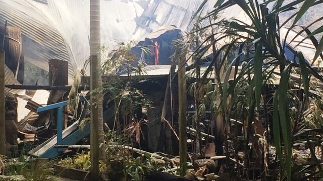 A house fire still smouldering at Byron Bay