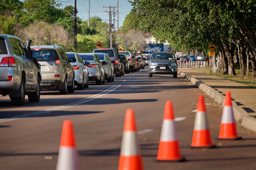 A long line of cars with people waiting to be tested at Marrara in Darwin.