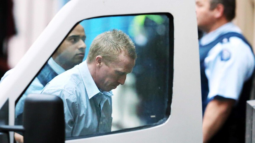 Adrian Bayley is taken from a prison van and led into the Melbourne Supreme court for sentencing.