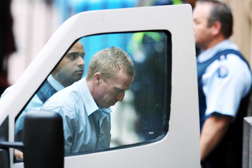 Adrian Bayley is taken from a prison van and led into the Melbourne Supreme court for sentencing.