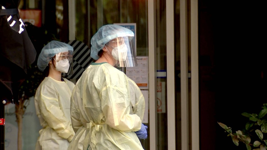 Staff in protective personal equipment at the Pullman Adelaide medi-hotel.