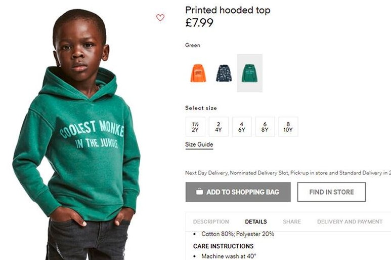 H&M online advertisement shows black child model wearing a green hoodie that says "coolest monkey in the jungle".