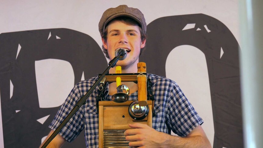 Jackson Church plays a customised washboard and sings.