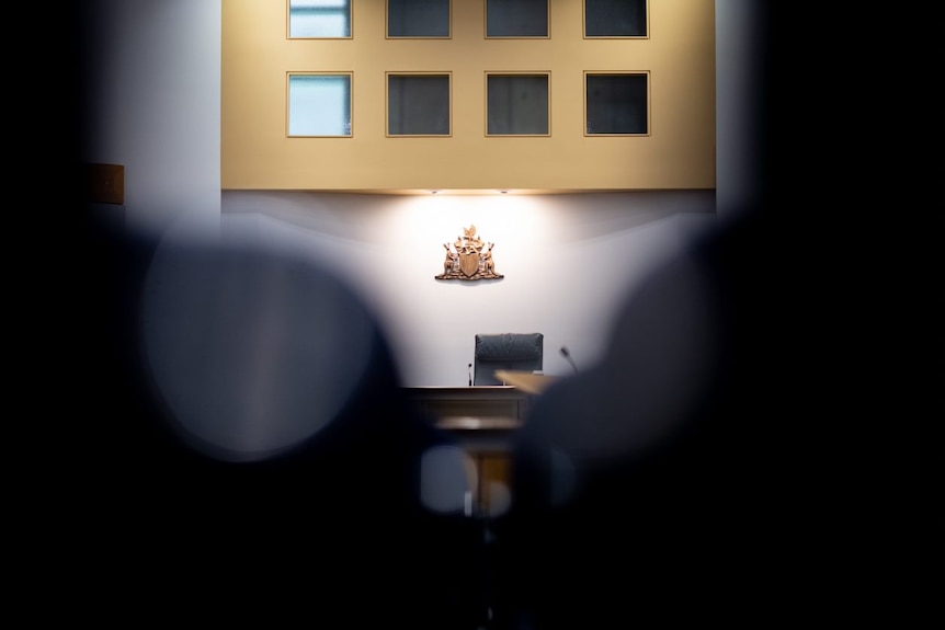 Moody photo of a judge's chair in the Supreme Court.