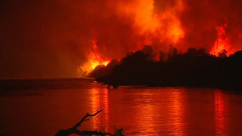 TV STILL of the fire threatening Brooms Head in northern New South Wales