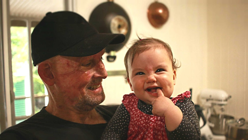 Matt Golinski shares a smile with his daughter Aluna Bennie Golinski at his home in Pomona.