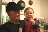 Matt Golinski shares a smile with his daughter Aluna Bennie Golinski at his home in Pomona.