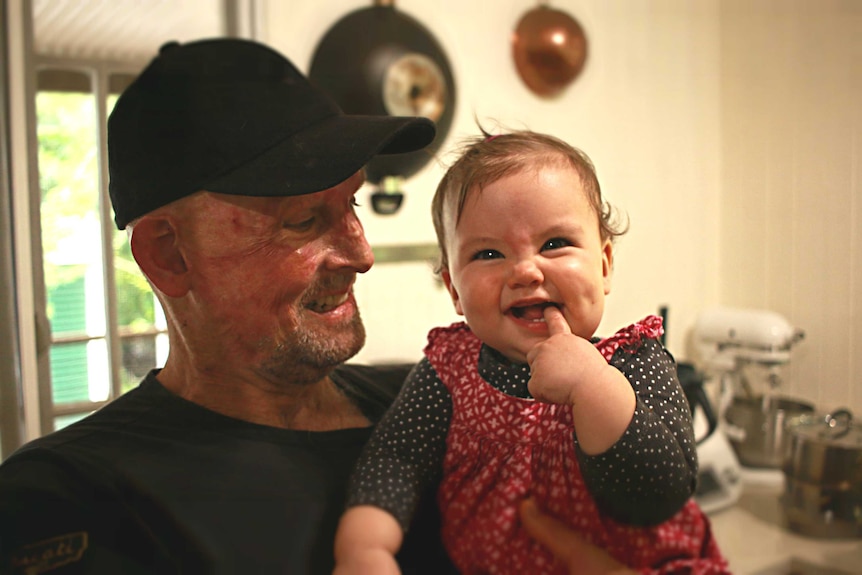 Matt Golinski shares a smile with his daughter Aluna Bennie Golinski at his home in Pomona.