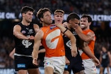 Toby Greene in a scuffle with Carlton players
