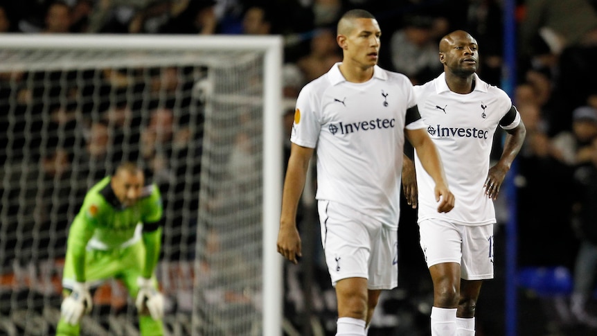 Tottenham Hotspur's Jake Livermore (L) and William Gallas react after PAOK Salonika score in their 2-1 Group A defeat at White Hart Lane.
