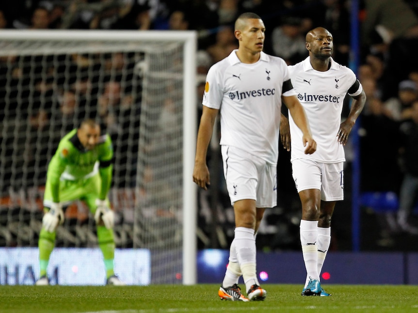 Tottenham Hotspur's Jake Livermore (L) and William Gallas react after PAOK Salonika score in their 2-1 Group A defeat at White Hart Lane.